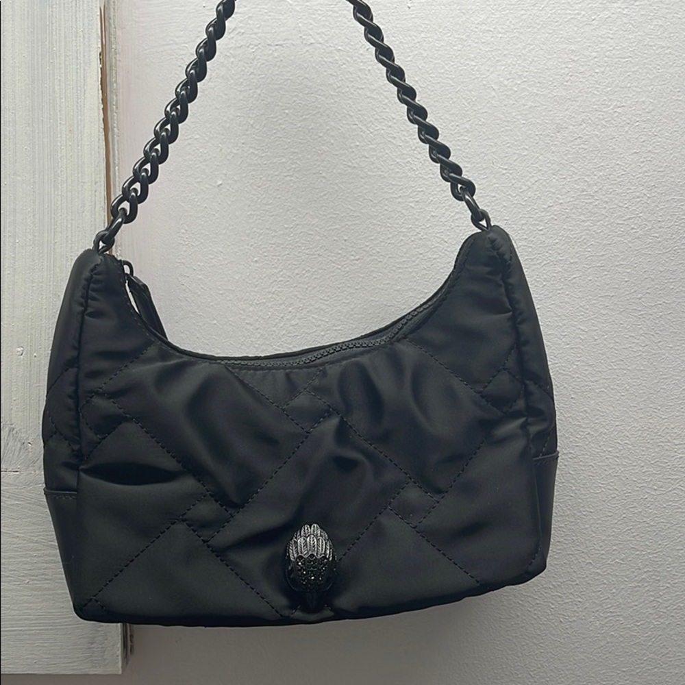 Black Kurt Keiger handbag.